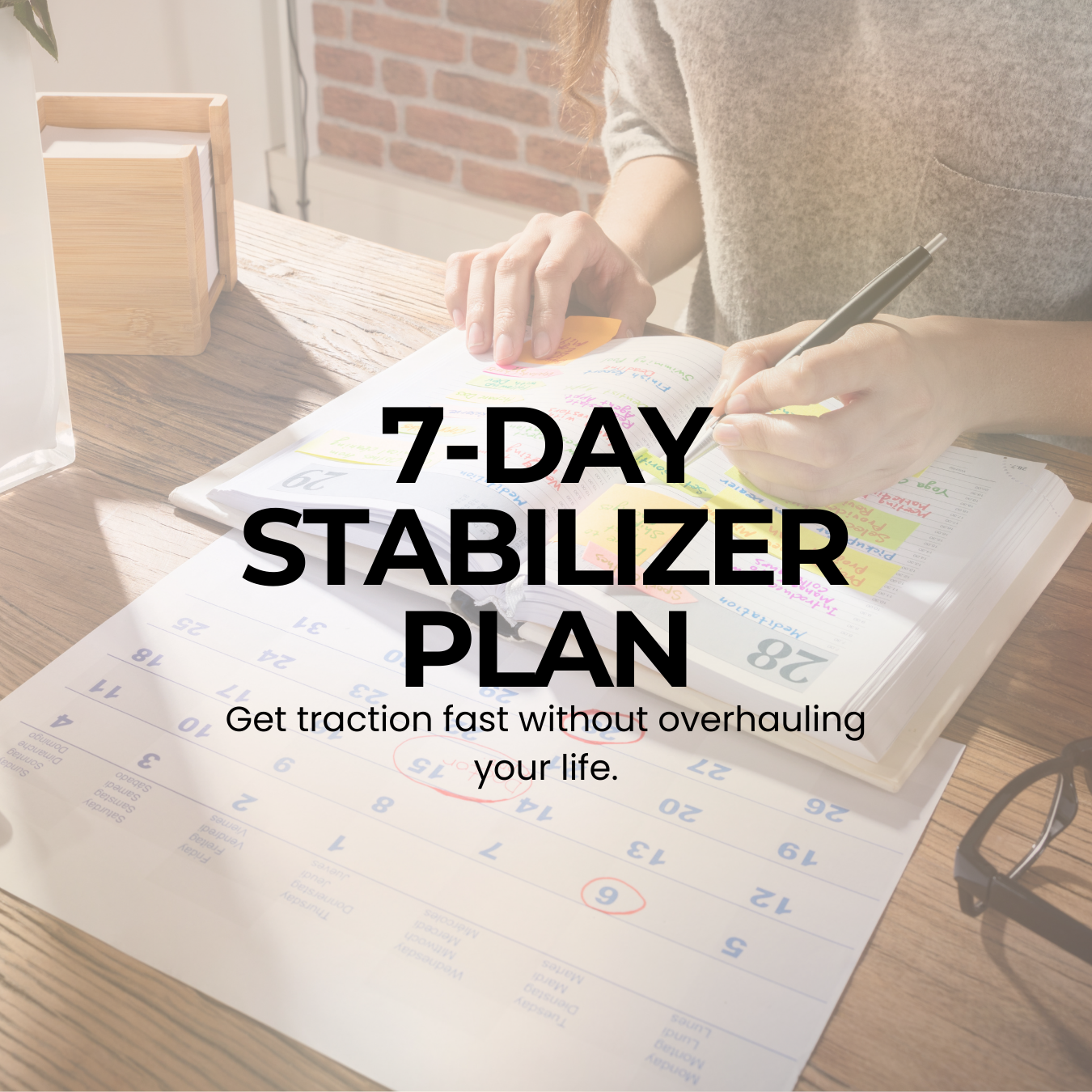 The cover of the 7-Day Stabilizer Plan featuring a woman writing in a notebook at a table with a calendar as she plans her schedule