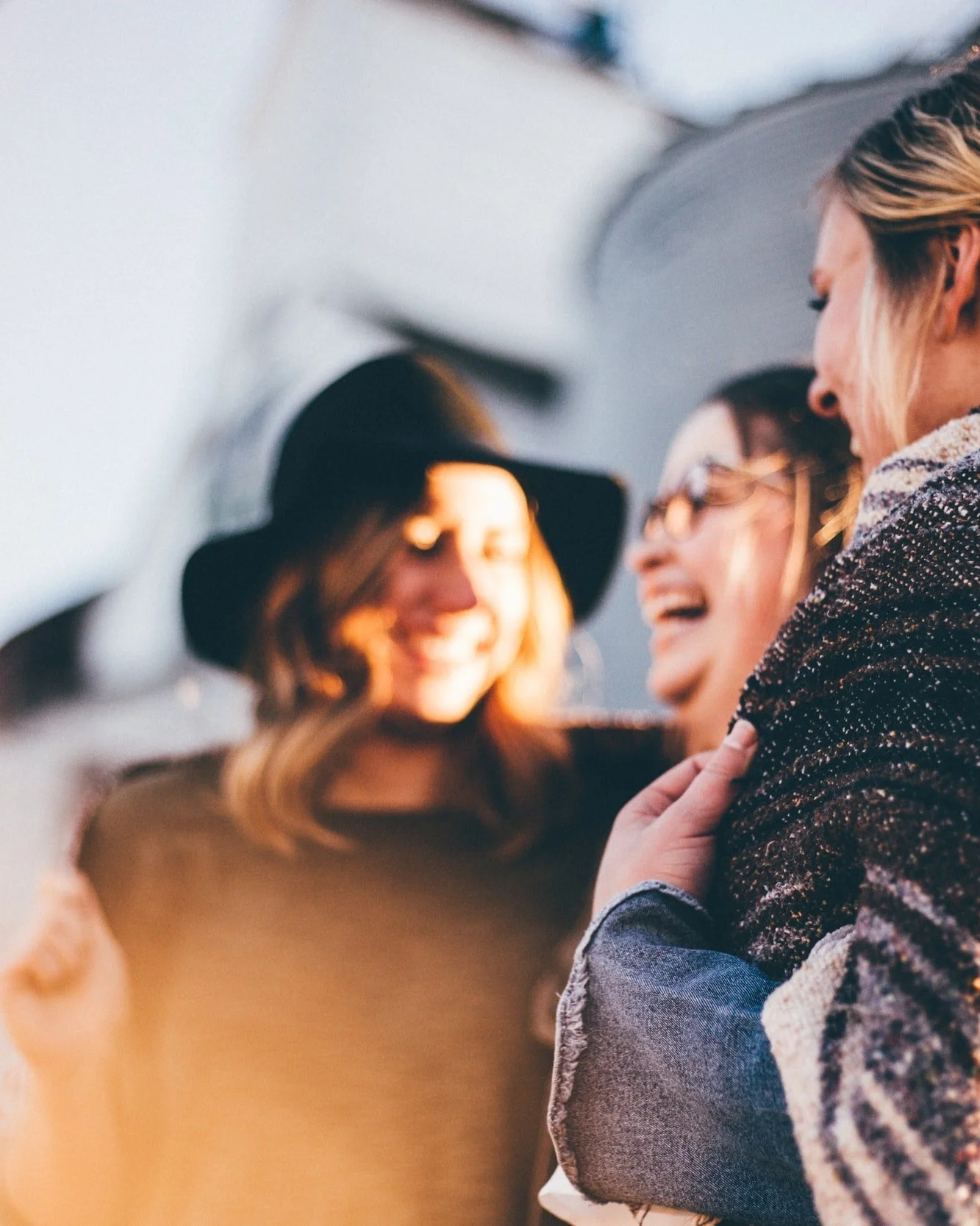 Three women smiling and having fun together