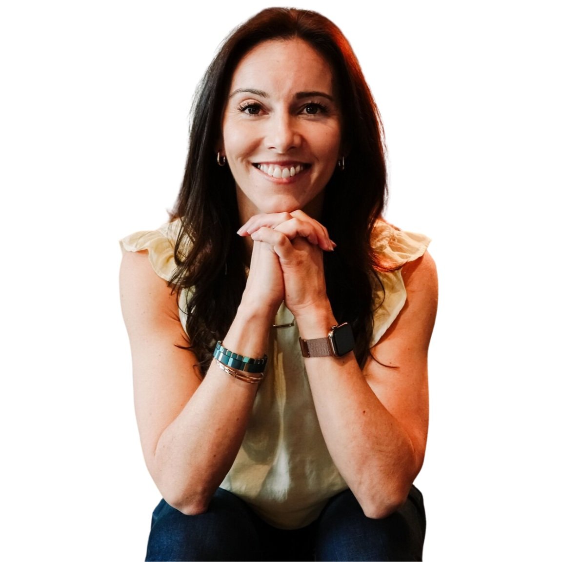 Amanda Hinman sitting on a couch and smiling in a headshot portrait