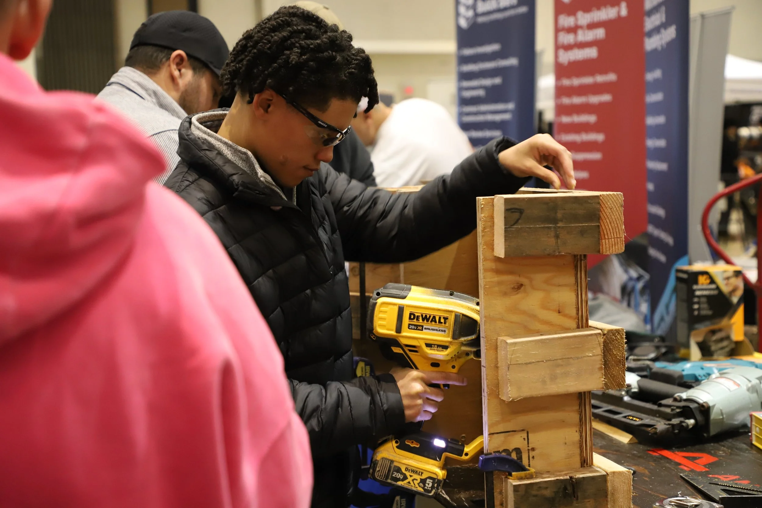 Photo of student drilling on wood