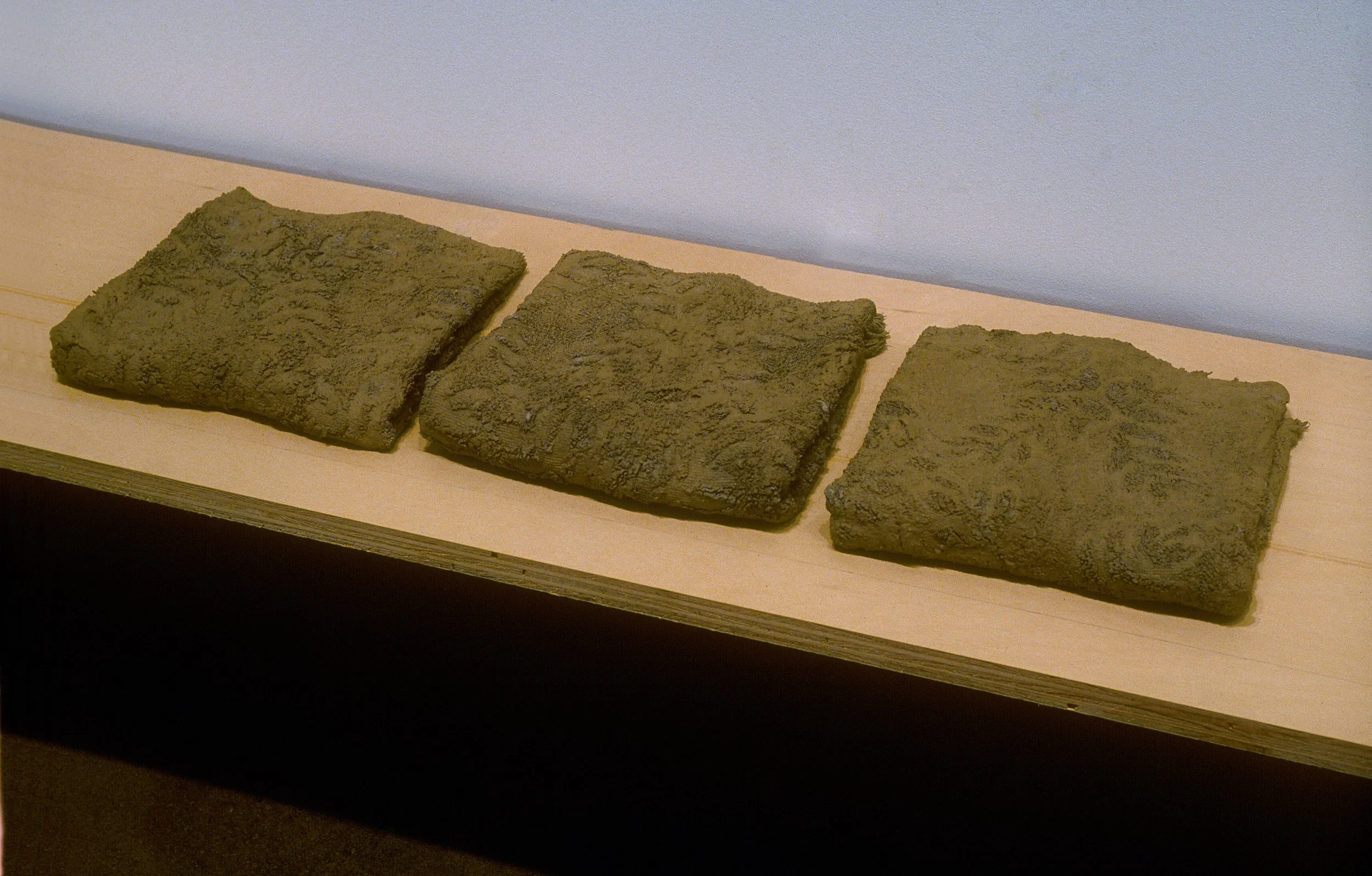   Trace, detail , 2001  used bath & hand towels, wash cloths, earth, plaster, birch plywood size varies
