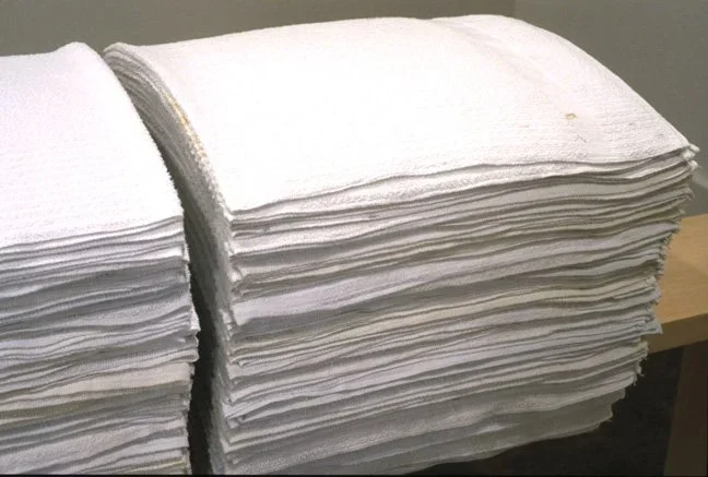   Accretion: Divide, detail , 2001  used terry hospital towels, basswood 72×9×32in approx. each, 5 benches