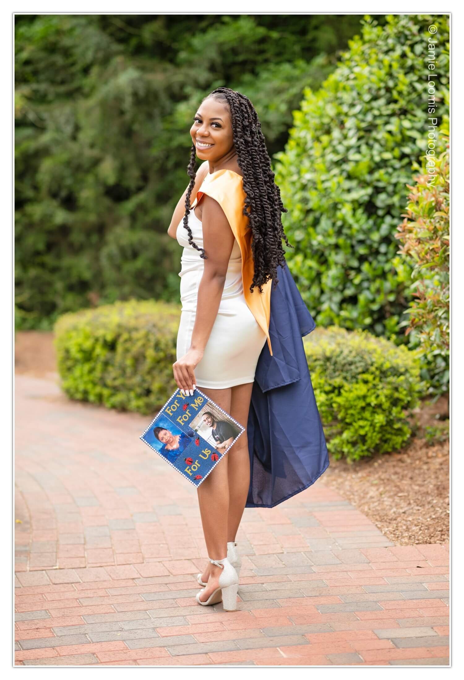 high school senior girl in white dress and cap &amp; gown for senior pics in North Carolina.