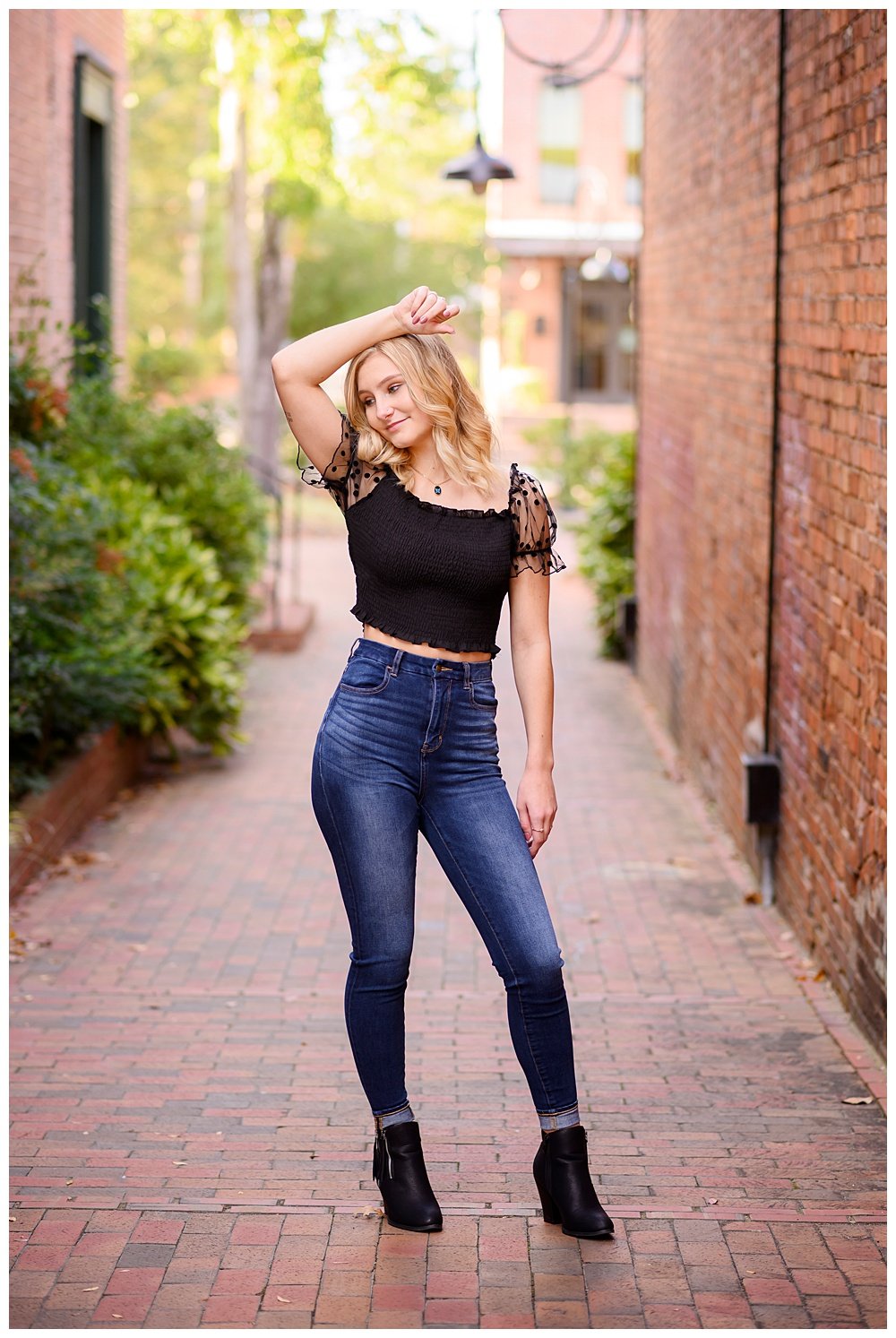Editorial Senior Picture in downtown Southern Pines Alley by NC Senior Portrait Photographer Jamie Loomis.