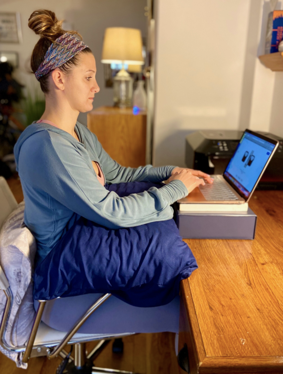 Sitting at desk/kitchen table:- sit all the way back in happy place- adjust seat height to rest feet on floor/box- place pillow/towel behind tailbone/low back- adjust monitor height to get as close to 10 deg below eye level if possible with boxes/books- support forearms with pillows to keep elbows higher than wrists to eliminate tension on neck