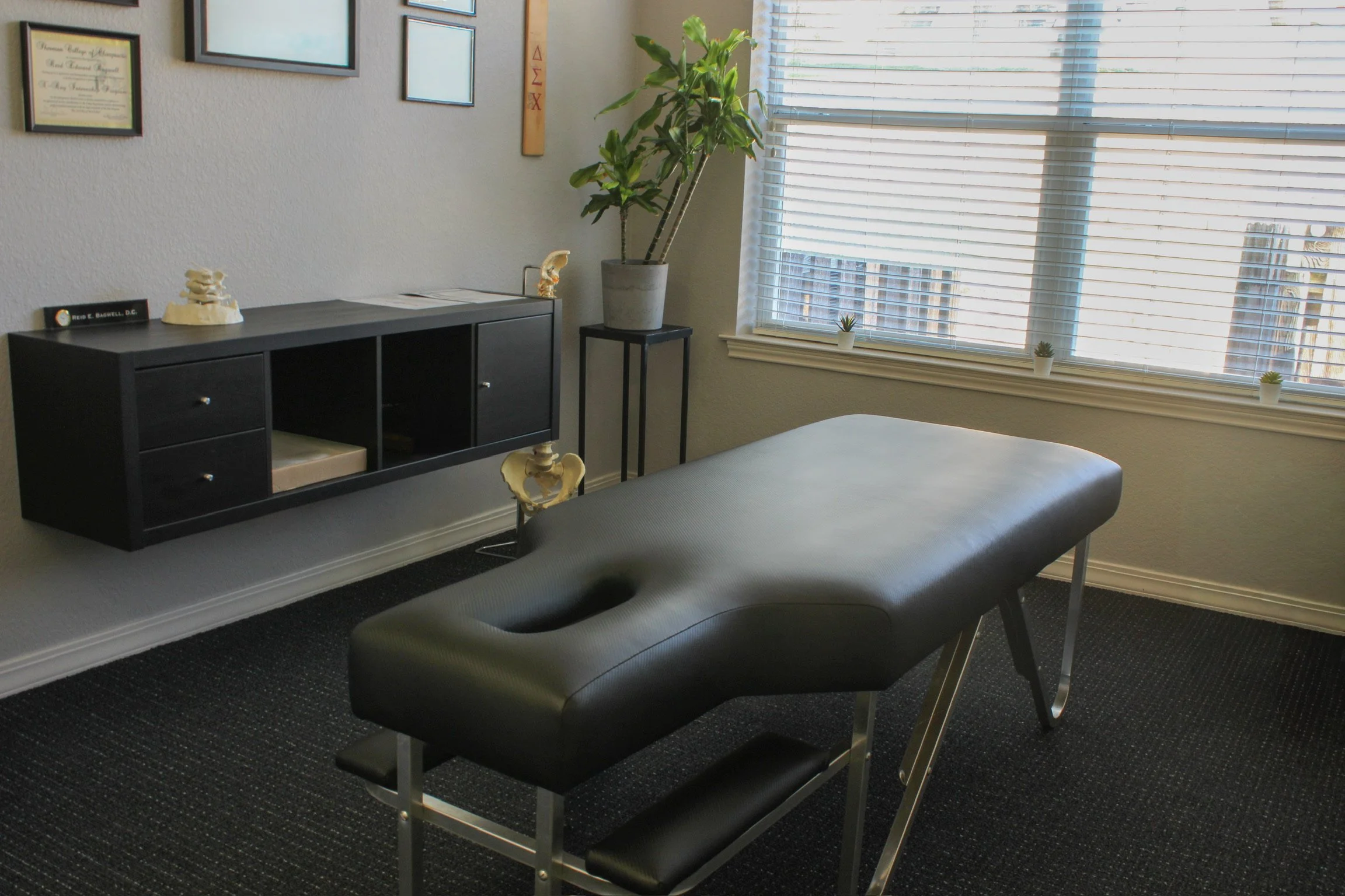 Exam room with treatment table at Be Well Chiropractic in Lakeway, TX
