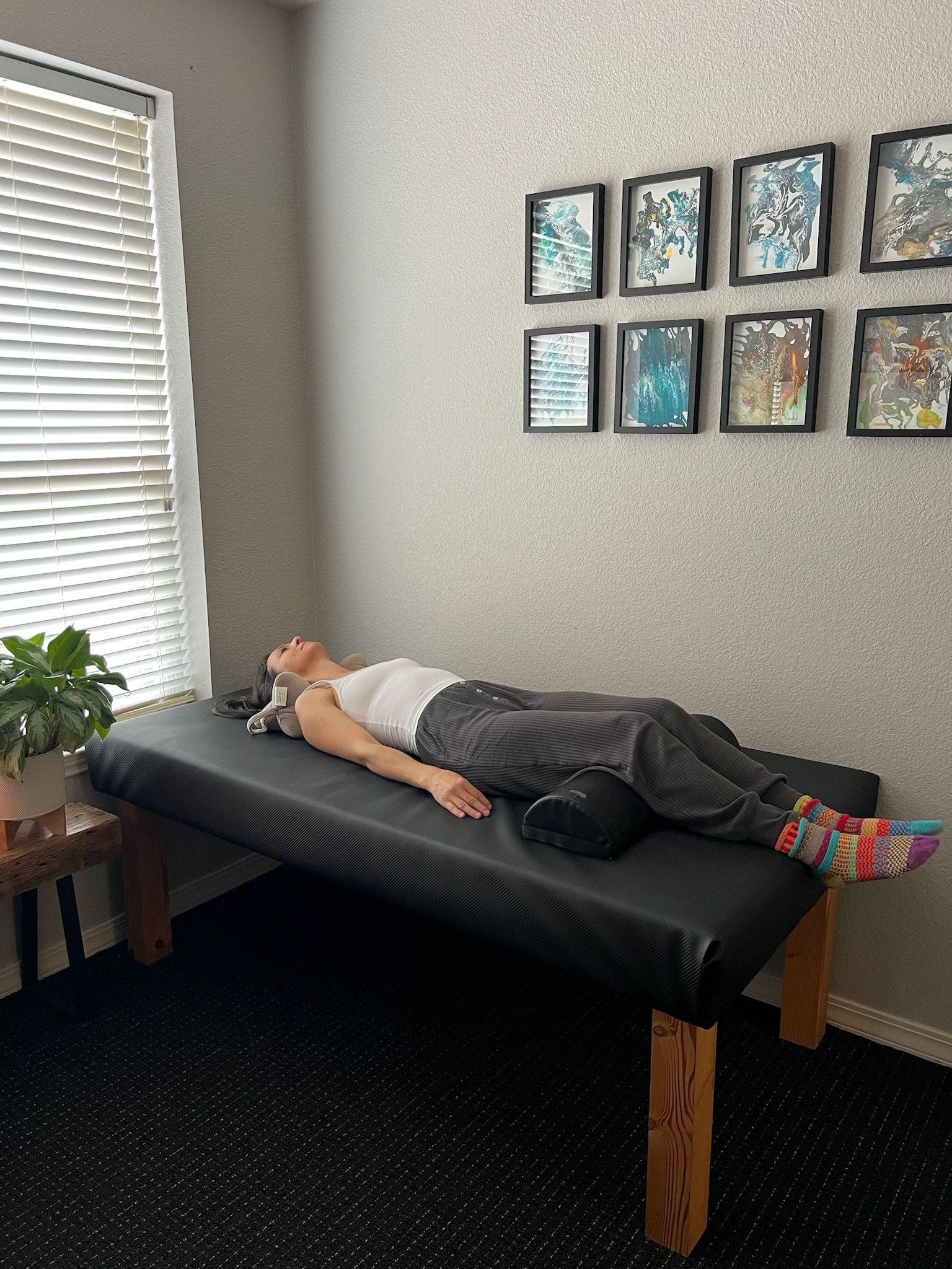 Patient resting on treatment table after chiropractic adjustment at Be Well Chiropractic in Lakeway, TX