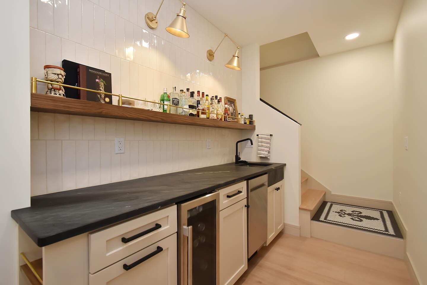 This wet bar is one of the many highlights of my recent personal basement finish. Featuring custom shelving with brass rails, mini dishwasher, glass rinser and beverage cooler. My favorite part of the whole build&hellip; the natural soap stone counte