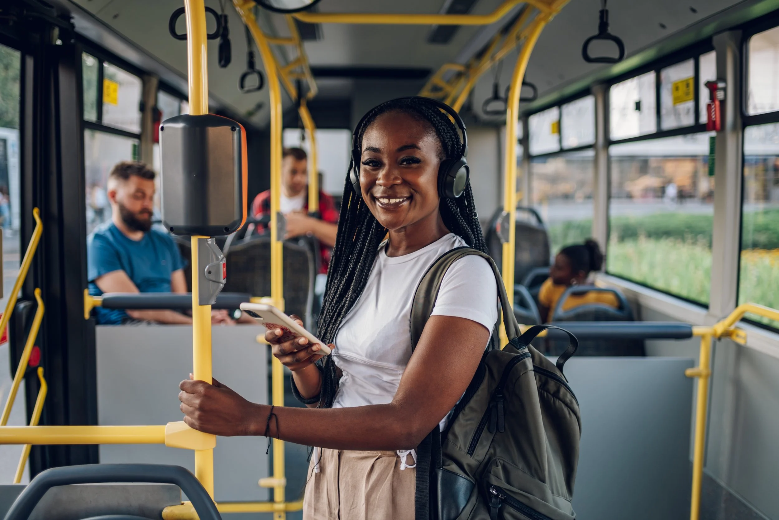 african-american-woman-riding-in-a-bus-and-using-a-2025-04-01-13-08-47-utc.jpg