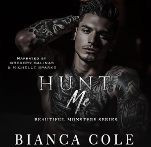 A tattooed, shirtless man with his right arm raised behind his head.