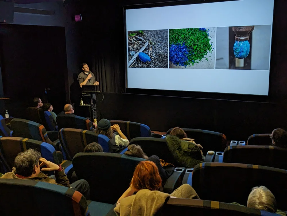 Rory Dickens presenting on desktop plastic recycling to a seated audience