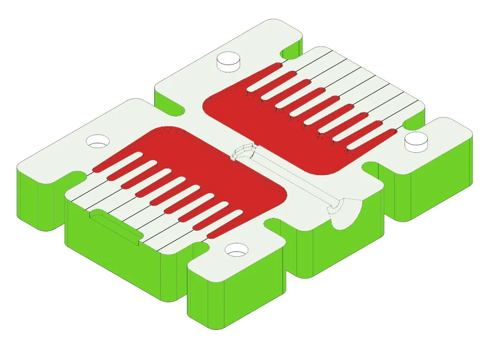Diagram of an open aluminium mould with three zones shaded: the cavity face marked red, the outer body marked green, and the mating face marked light green.