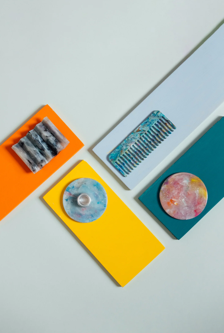 Custom Moulds service, parts photographed alongside the moulds that produced them