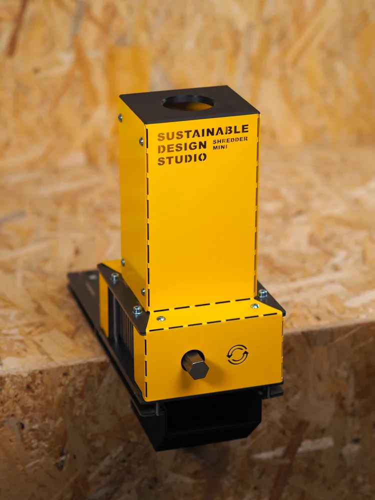 Shredder Mini V2 hand crank in use, showing the universal hex shaft drive