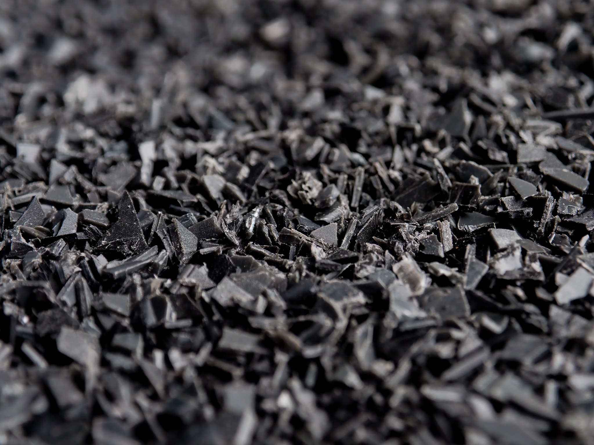 Black shredded plastic close up