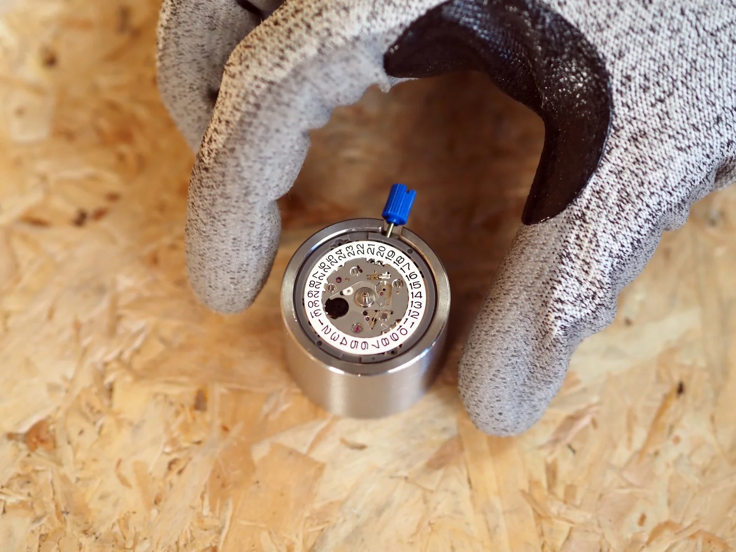Two of the four dial locating pins snipped flush before fitting.