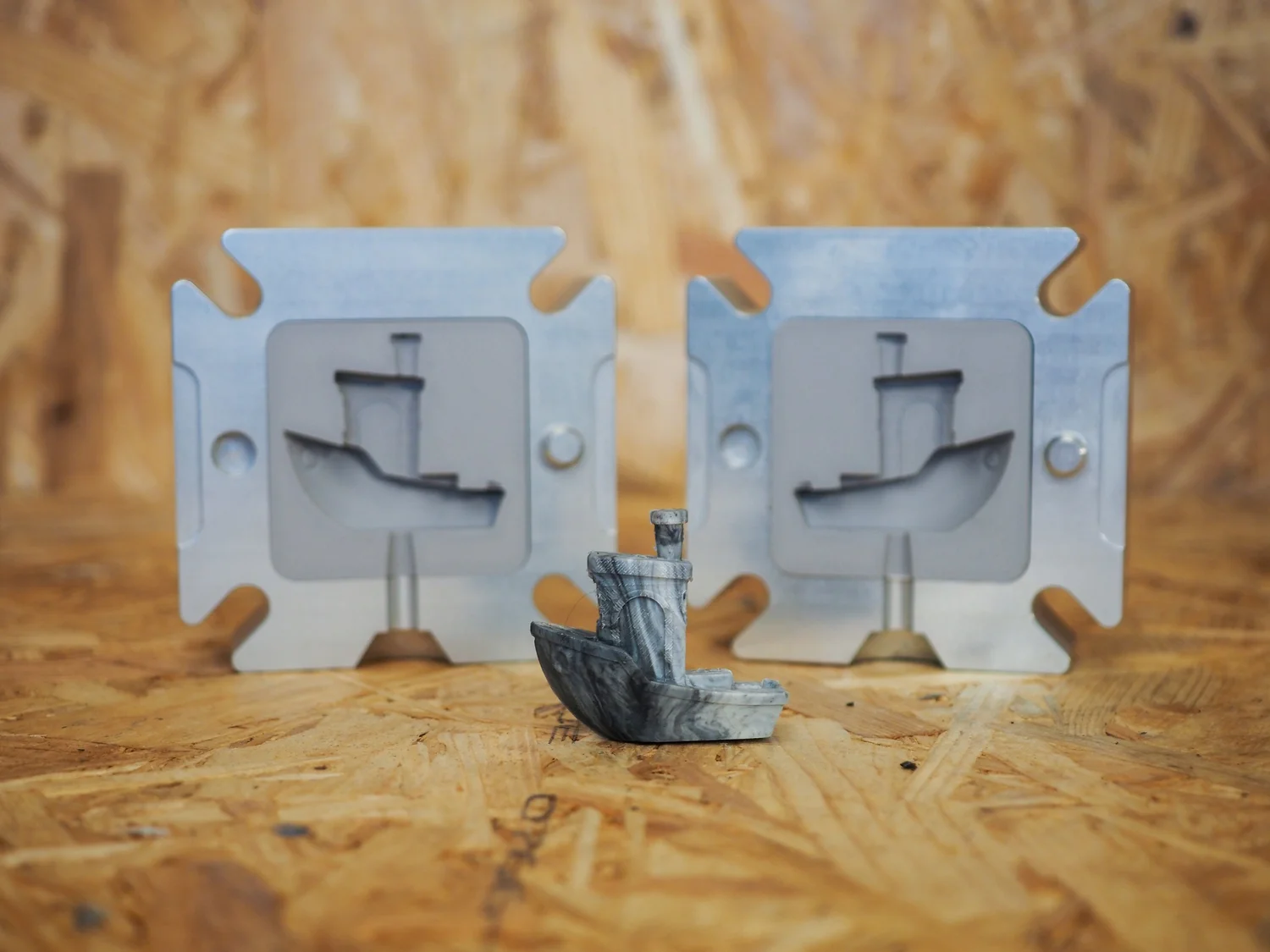 Failed 3D prints on one side, recycled flake and moulded products on the other, the two ends of the reuse workflow.