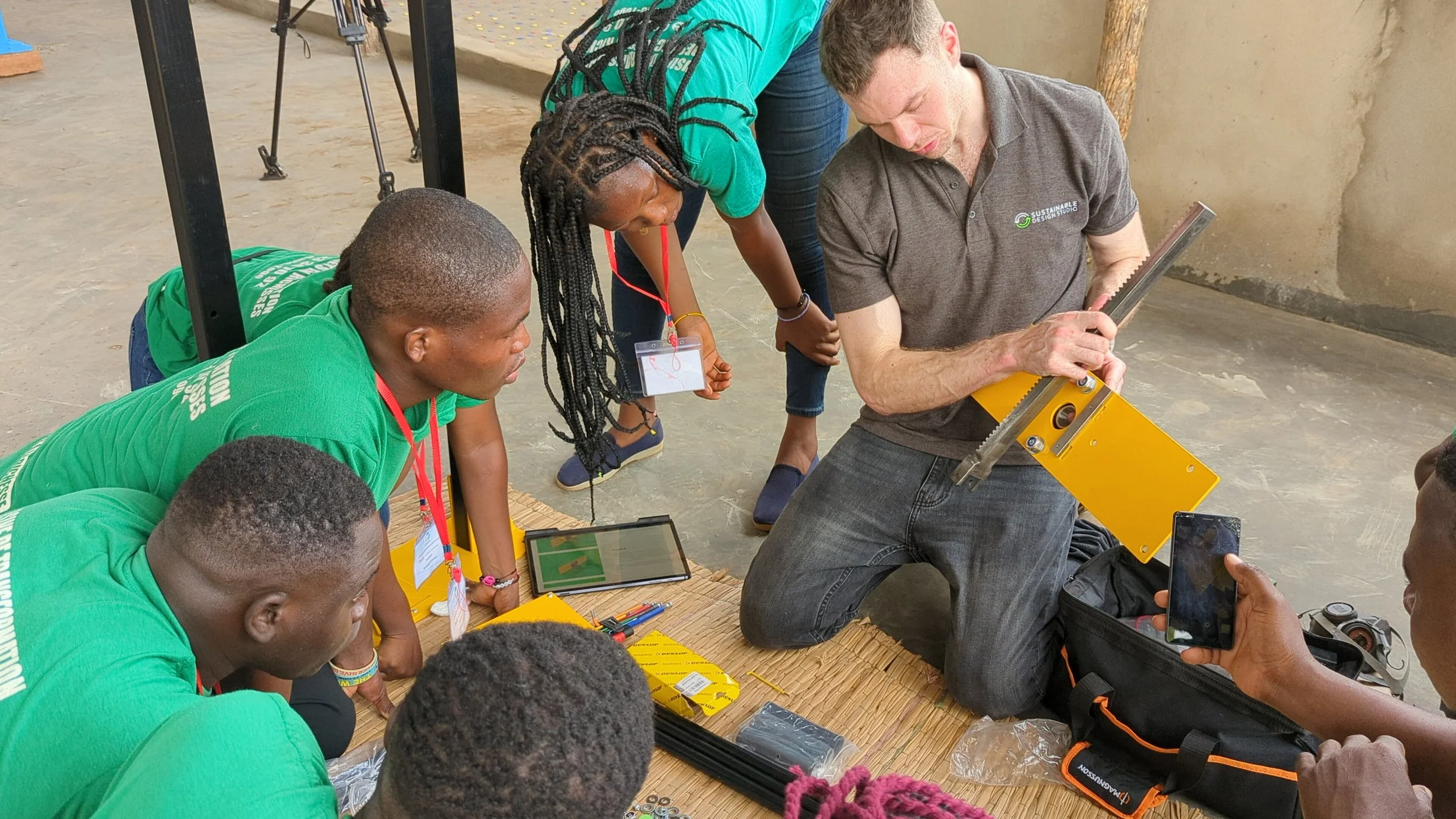 Rory Dickens training a group on a Sustainable Design Studio machine in Togo