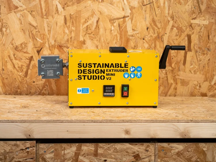 Extruder Mini V2 on a workshop bench, showing its 10kg compact footprint