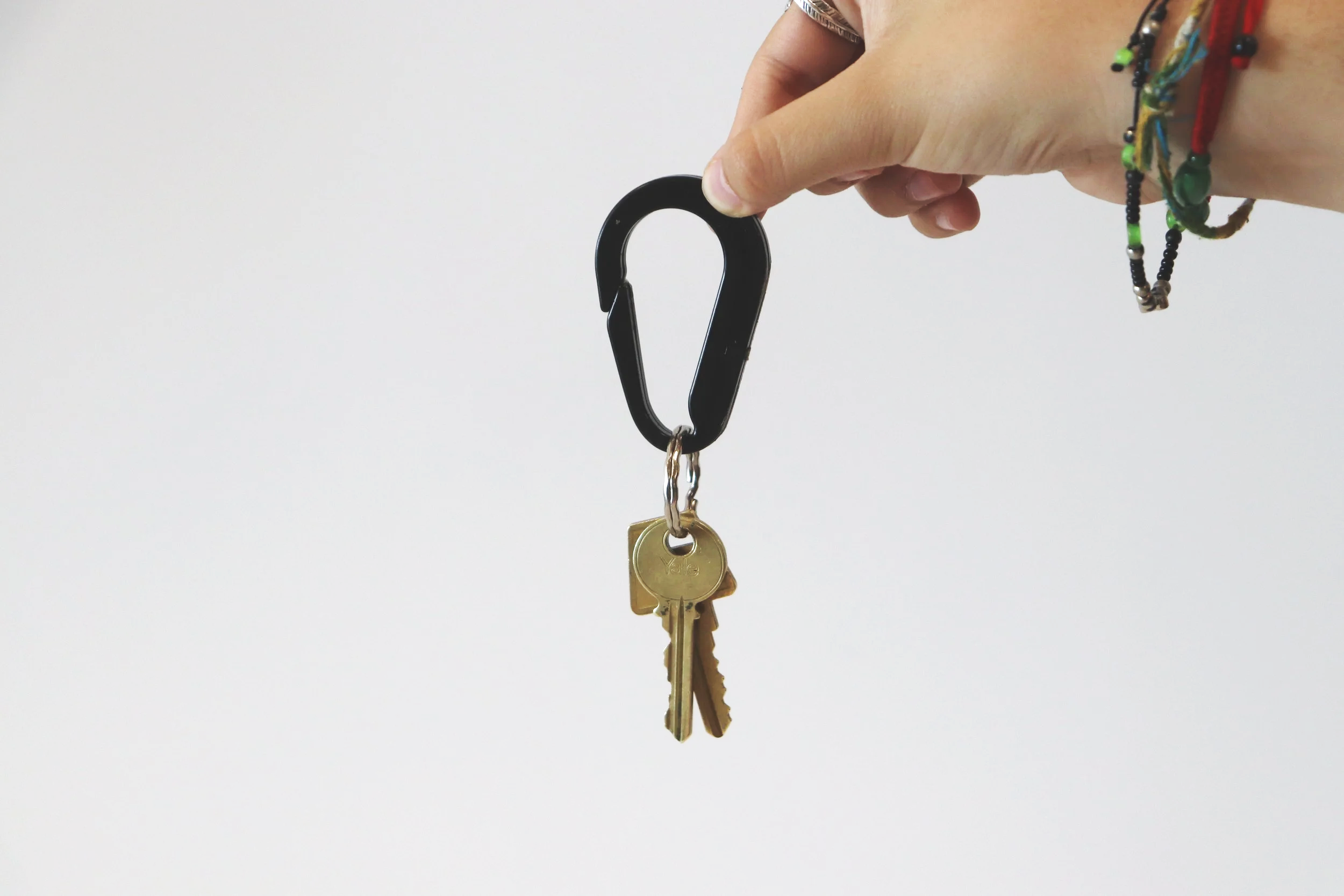 Carabiner being held by a hand holding keys