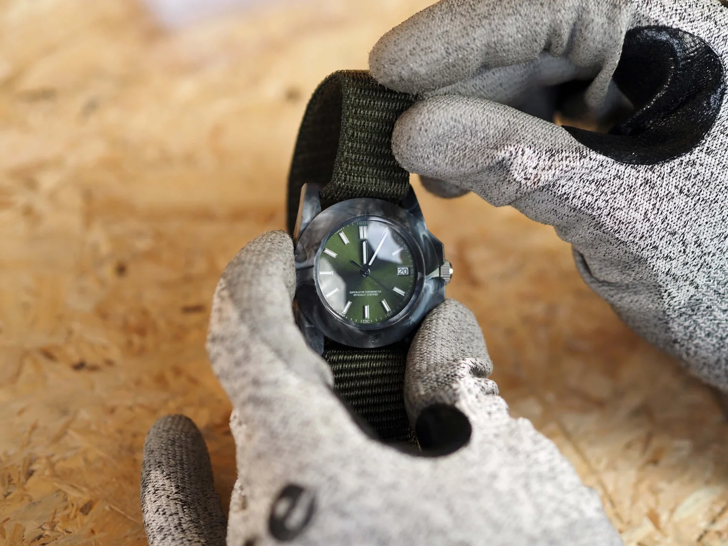 Velcro strap threaded through the watch case slots, build complete.