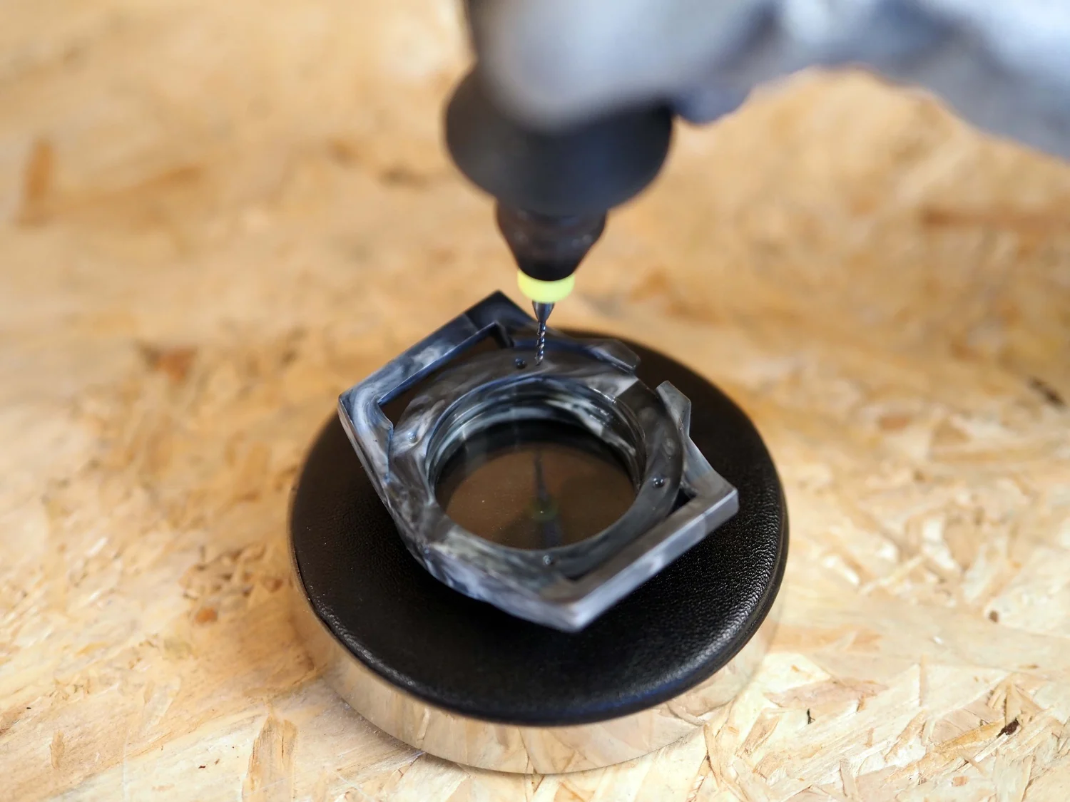 Drilling the crown hole into the side of the moulded watch body.