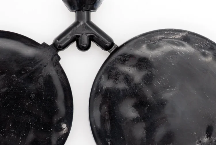 A moulded part with shallow dimples across a surface that should be flat.