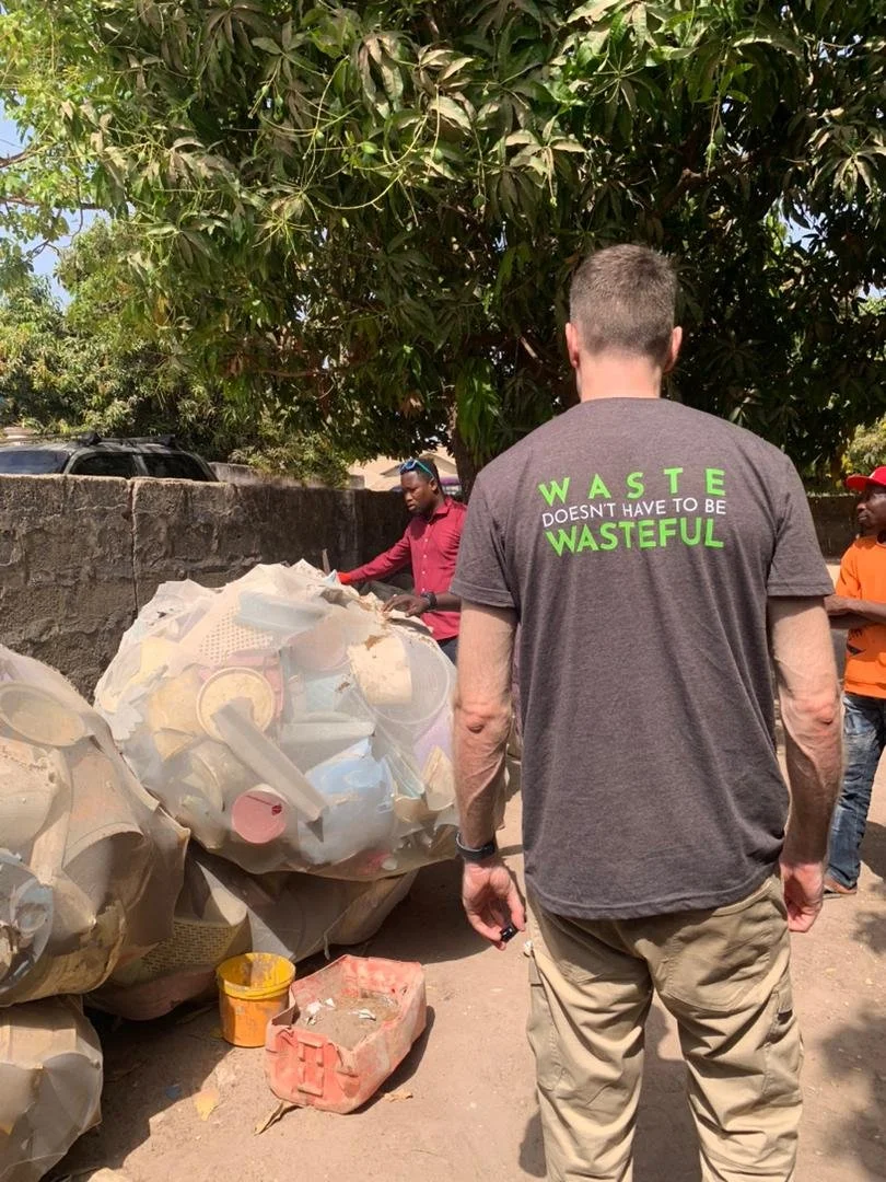 Sustainable Design Studio on site, assessing bulk bags of sorted plastic waste with a local collection team