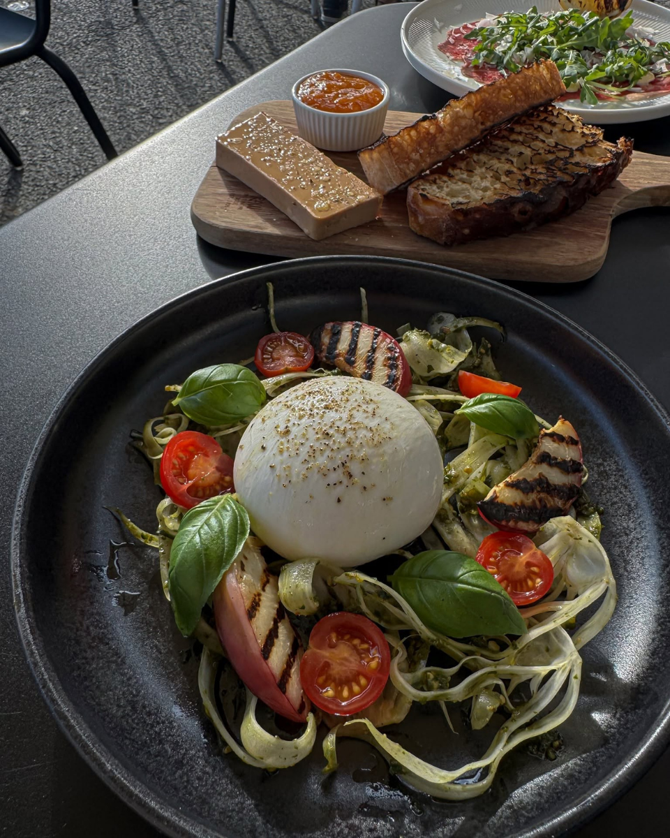 Burrata-style starter with tomatoes, basil and grilled vegetables served at Restaurant Fleisch in Copenhagen’s Meatpacking District.