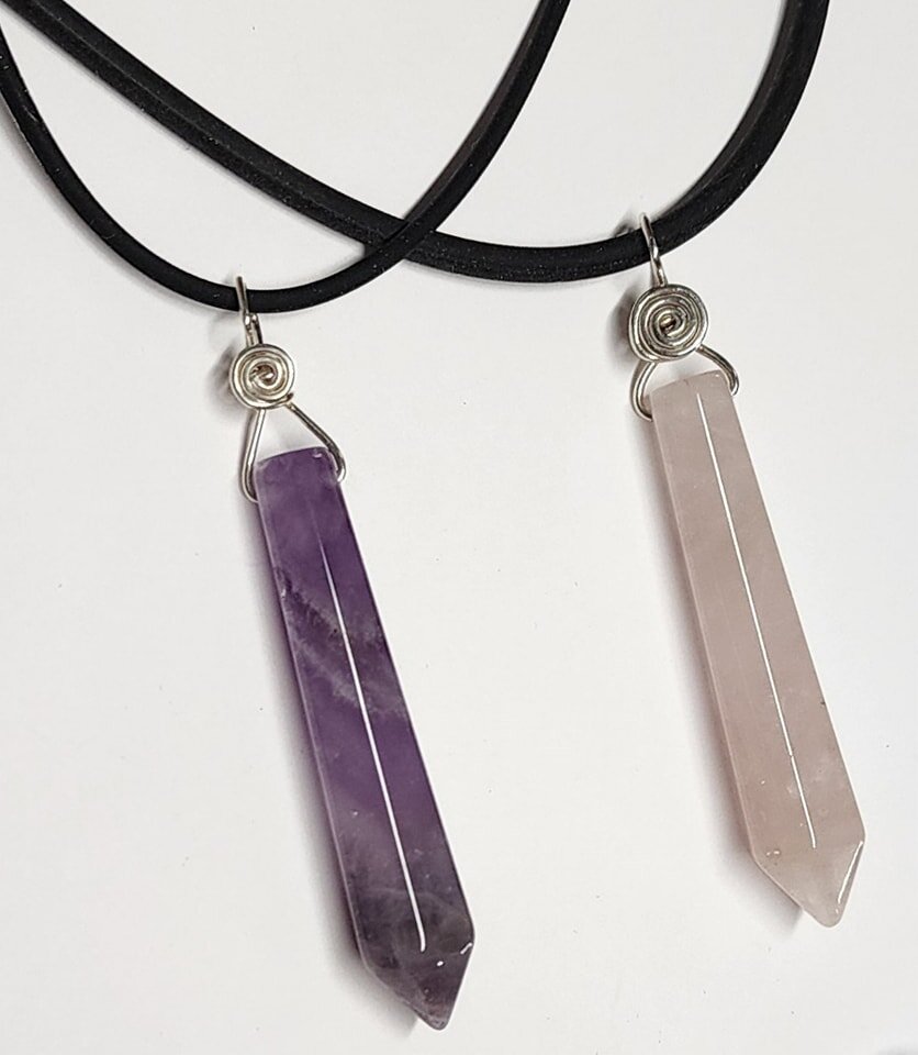 Faceted gemstone points make great gifts, and these are nicely wire-wrapped in .935 Argentium silver -- a more pure tarnish-resistant form than .925 sterling. Dog teeth amethyst on the left for $25, pale rose quartz on the right in heavier silver for