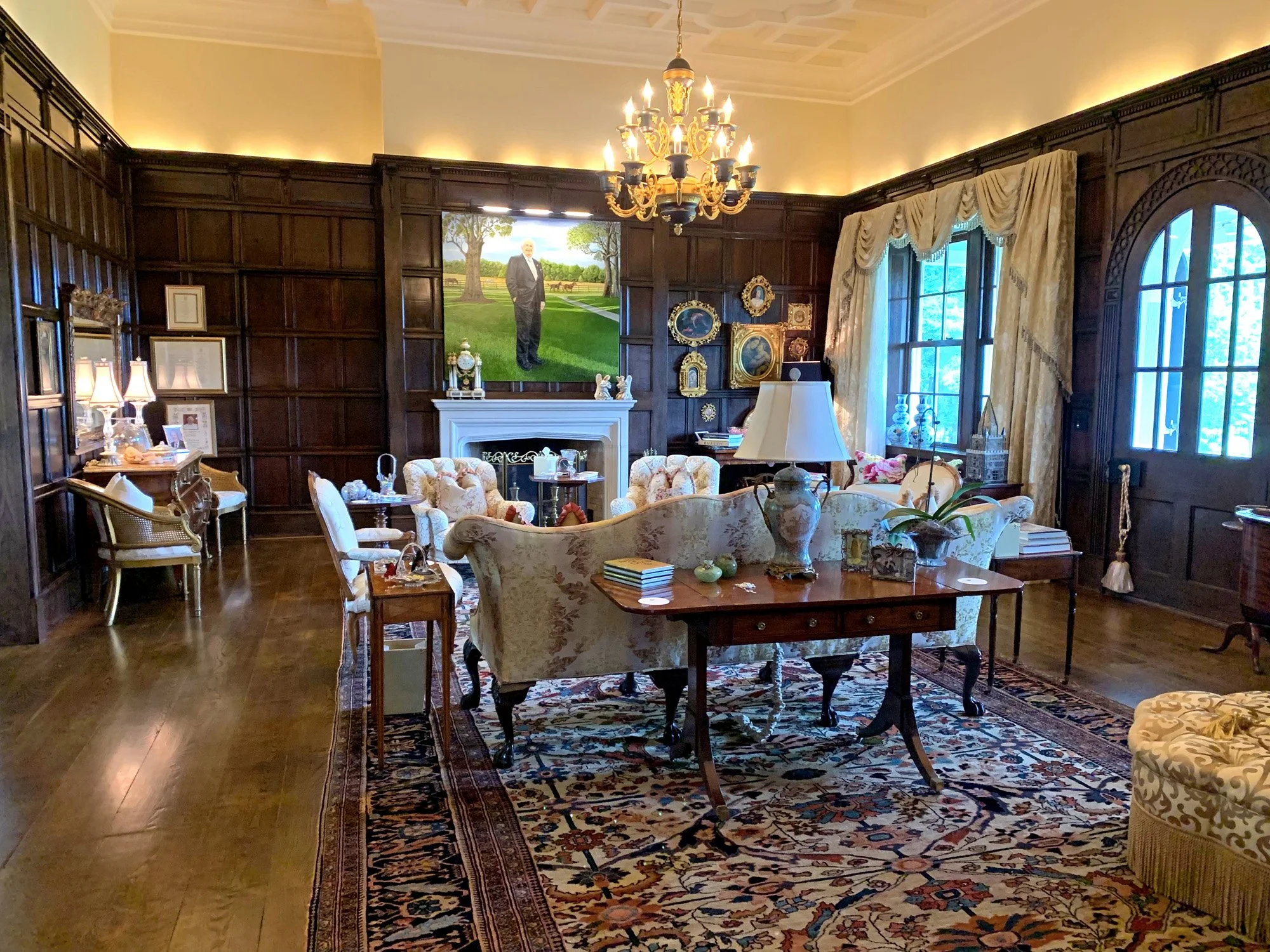 Living Room - The walls are covered in oak paneling from Nerquis Hall in Wales circa 1740. The ceiling was inspired by an English country estate and is custom molded plaster. The roof atop the Living Room is made from 16,250 riven slate tiles. Both t
