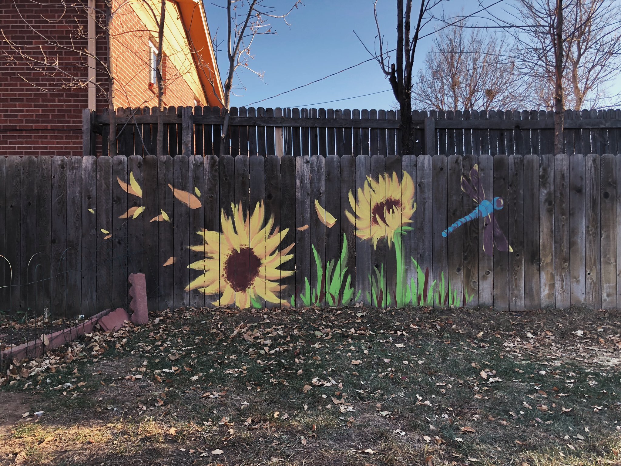 "Sunflower Mural - Section One" 2020, acrylic on wood fence