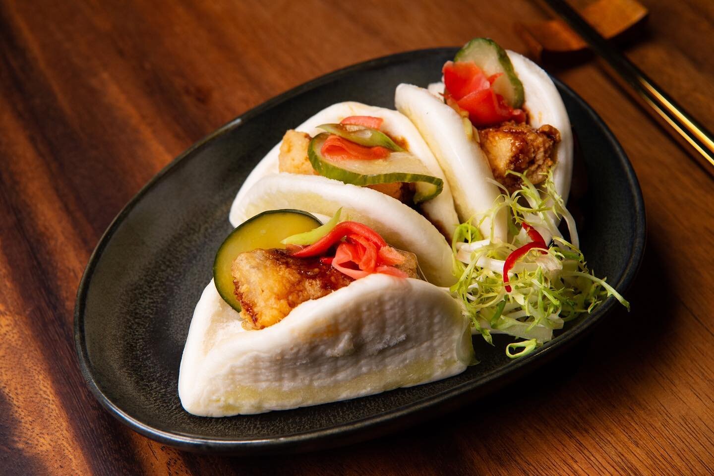 Bao Bun Bliss 😋 Black Cod with Pickled Vegetables and Shallots in our delicious Bao Bun with Dynasty Sauce!