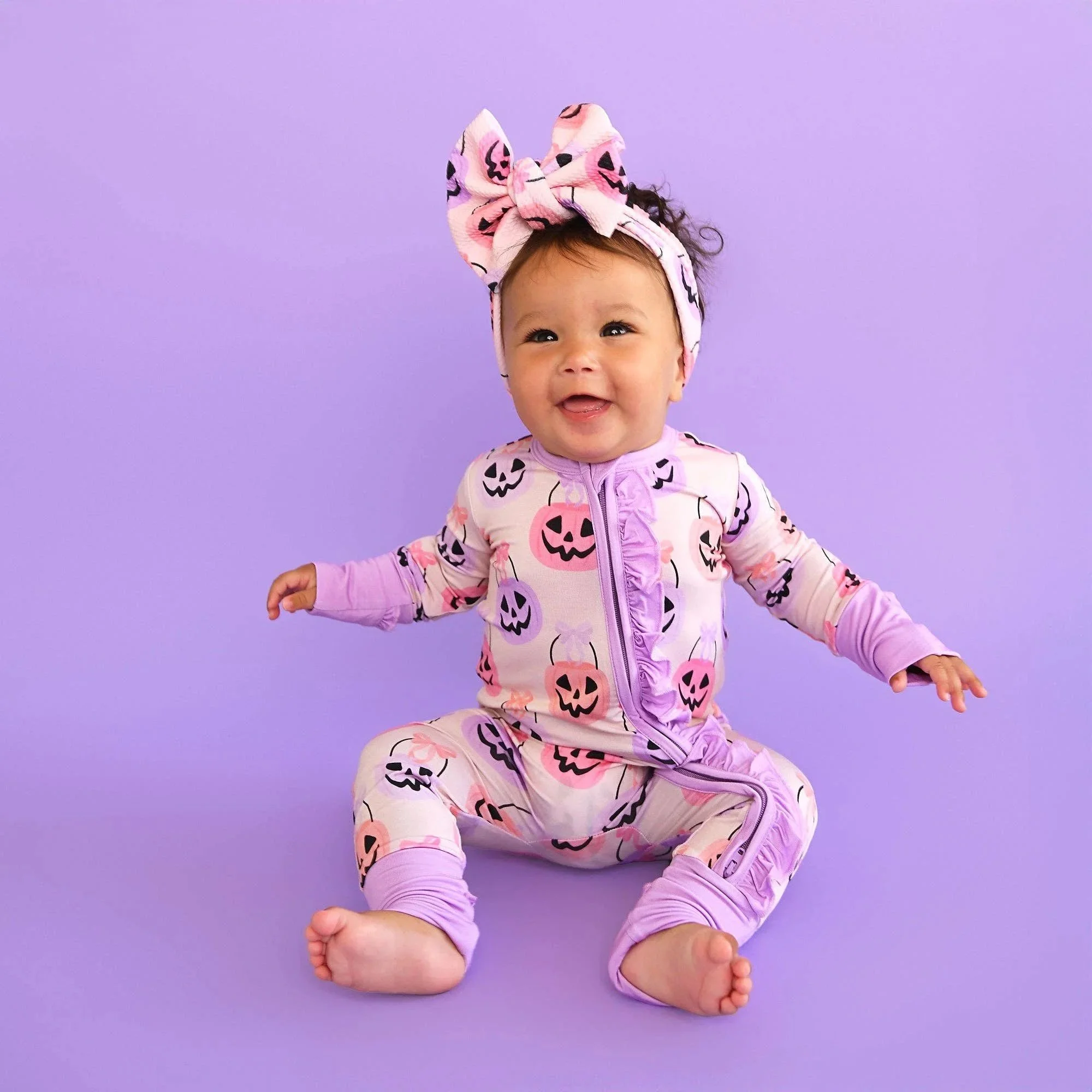 emmy-ruffle-zip-bamboo-halloween-pumpkins-baby-outfit-17.jpg