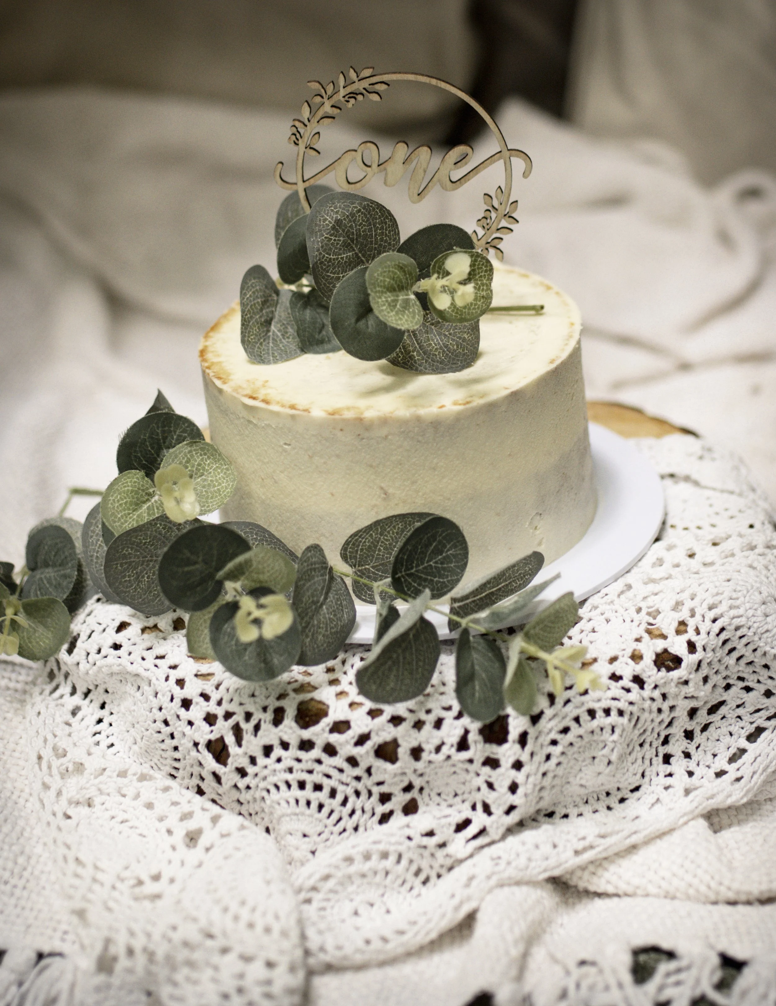 Naked boho style cake with eucalyptus for 1st birthday photoshoot
