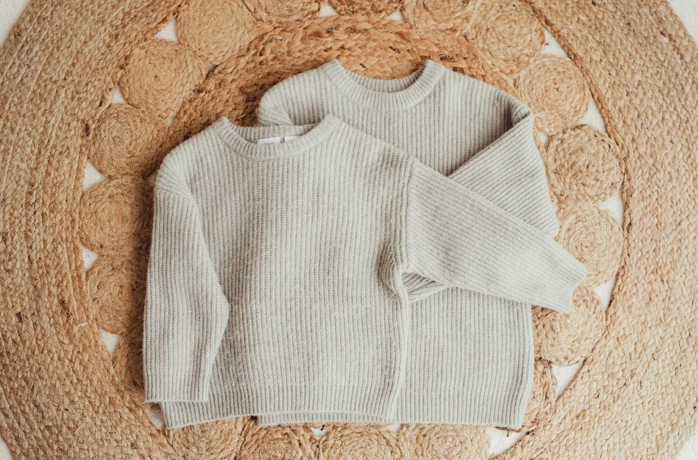 Matching sage green knitted jumpers 12-18 months and 5-6 years.