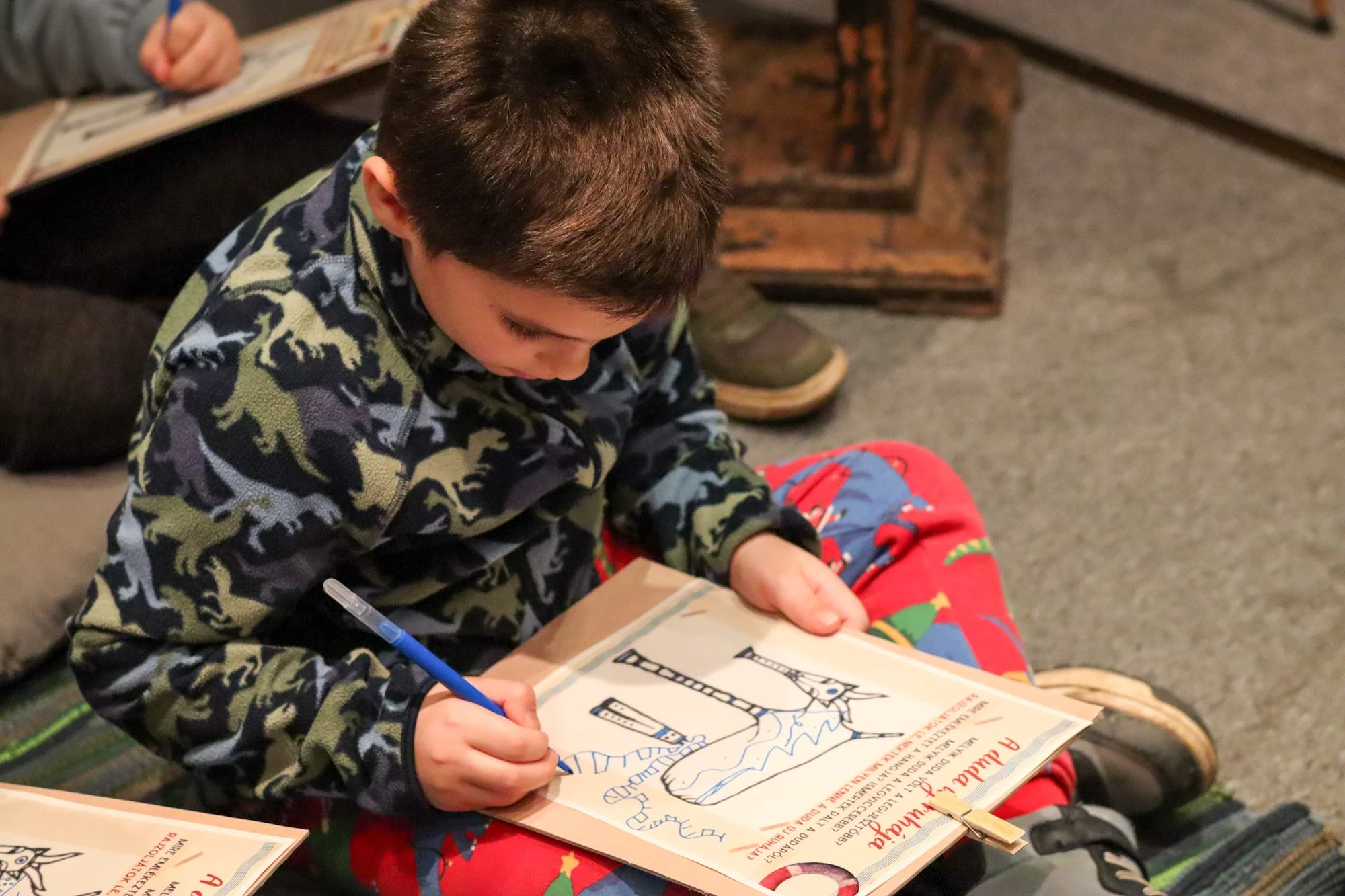 Child drawing at the bagpipe art exhibition