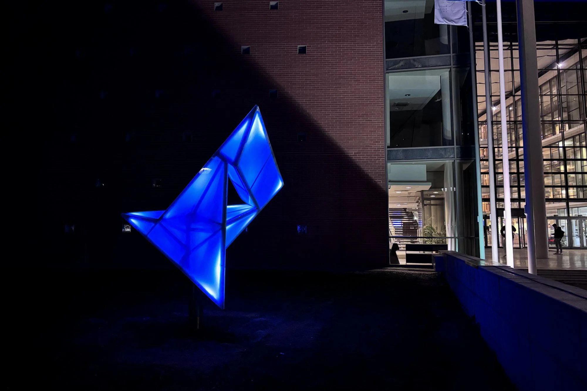 The Szilassi polyhedron statue at night in front of SZTE TIK