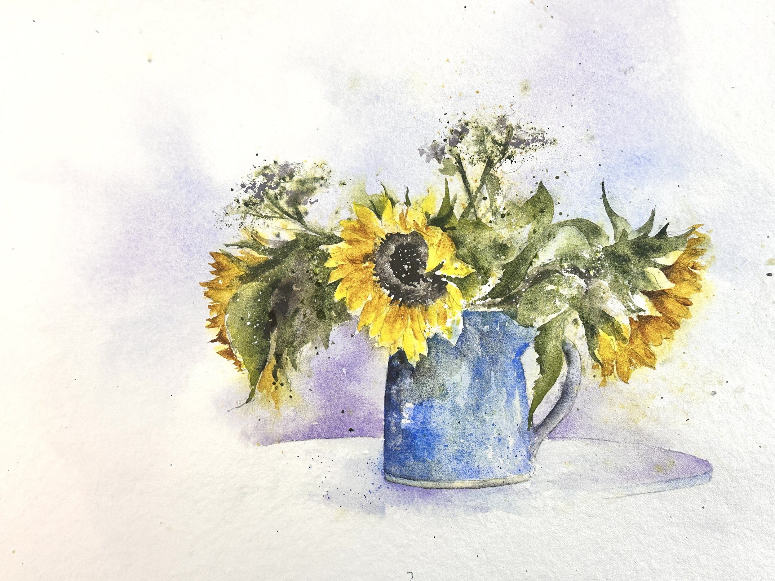 Watercolor painting of a sunflower bouquet in a blue pitcher.