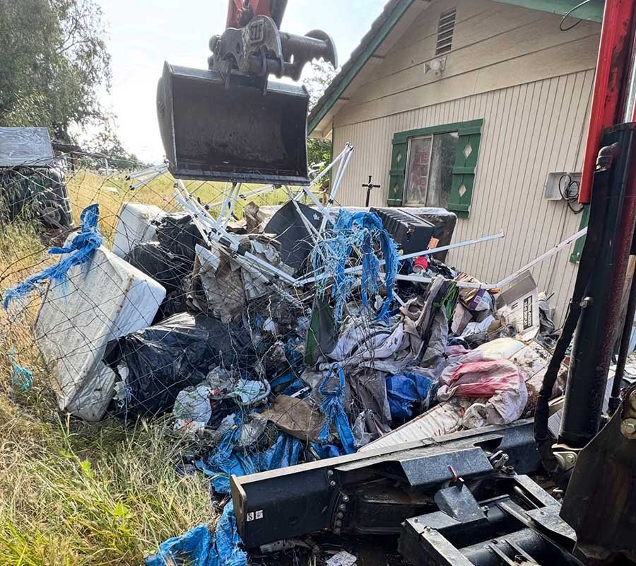 Backyard before junk removal and hauling service in Redding, CA from Shasta Strong Junk Removal