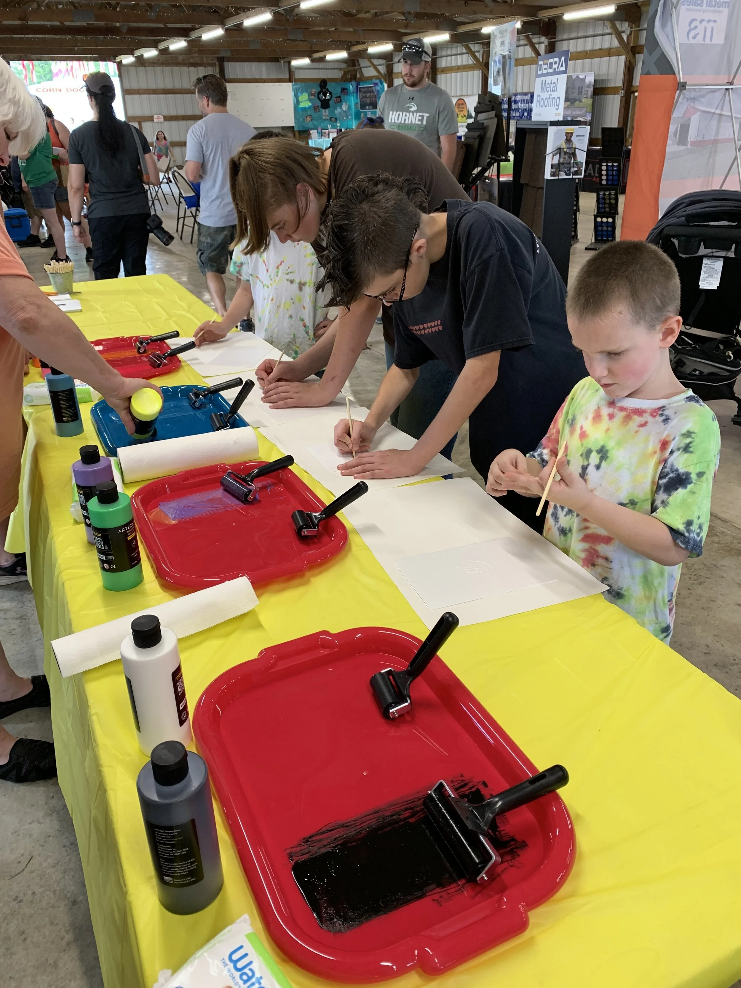 Brown County youth at the Summer Bash learn the basics of print-making.