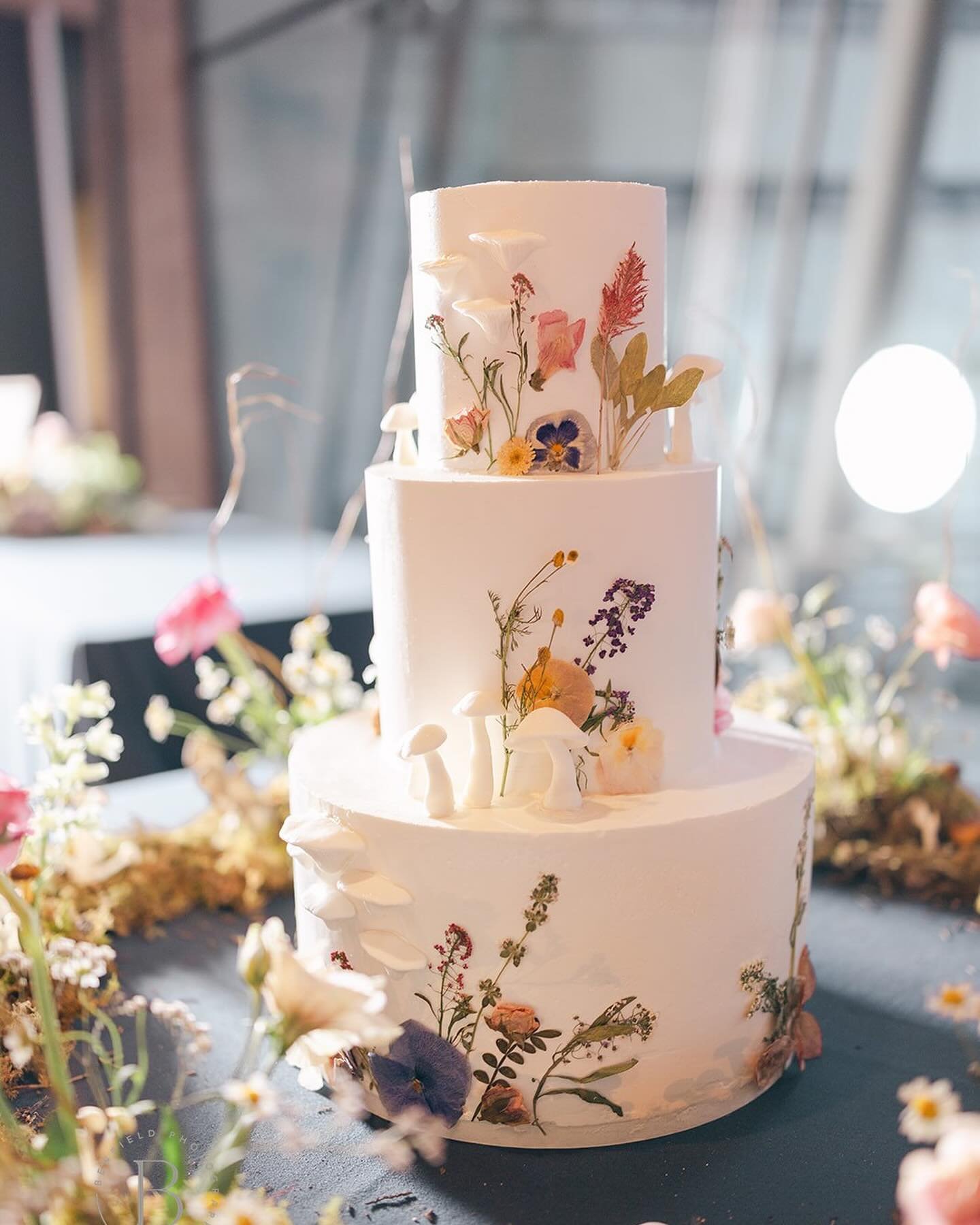 Photo credit: @dalebenfield 
Thank you for sharing these beautiful images with me! 

This was one of my favorite wedding cakes I&rsquo;ve done to date. When they said mushrooms and dried edible flowers my heart skipped a beat. The whole cake was lemo