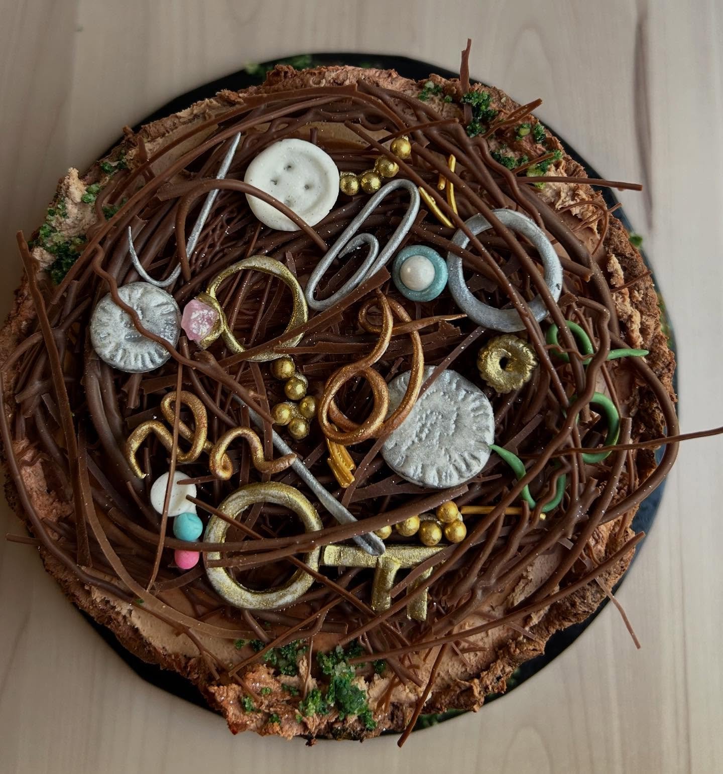 A nest of collected items. 🐦&zwj;⬛

#weirdcake