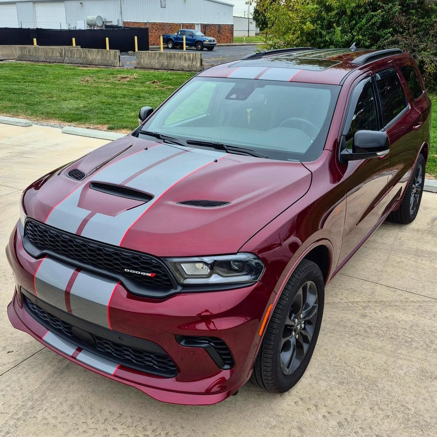 Sometimes simple is exactly what the car needs.

The customer wanted gloss graphite stripes, and that subtle contrast against the red gave the whole vehicle a cleaner, more aggressive look without overdoing it.

Vehicle Wraps &amp; Graphics | Dayton,