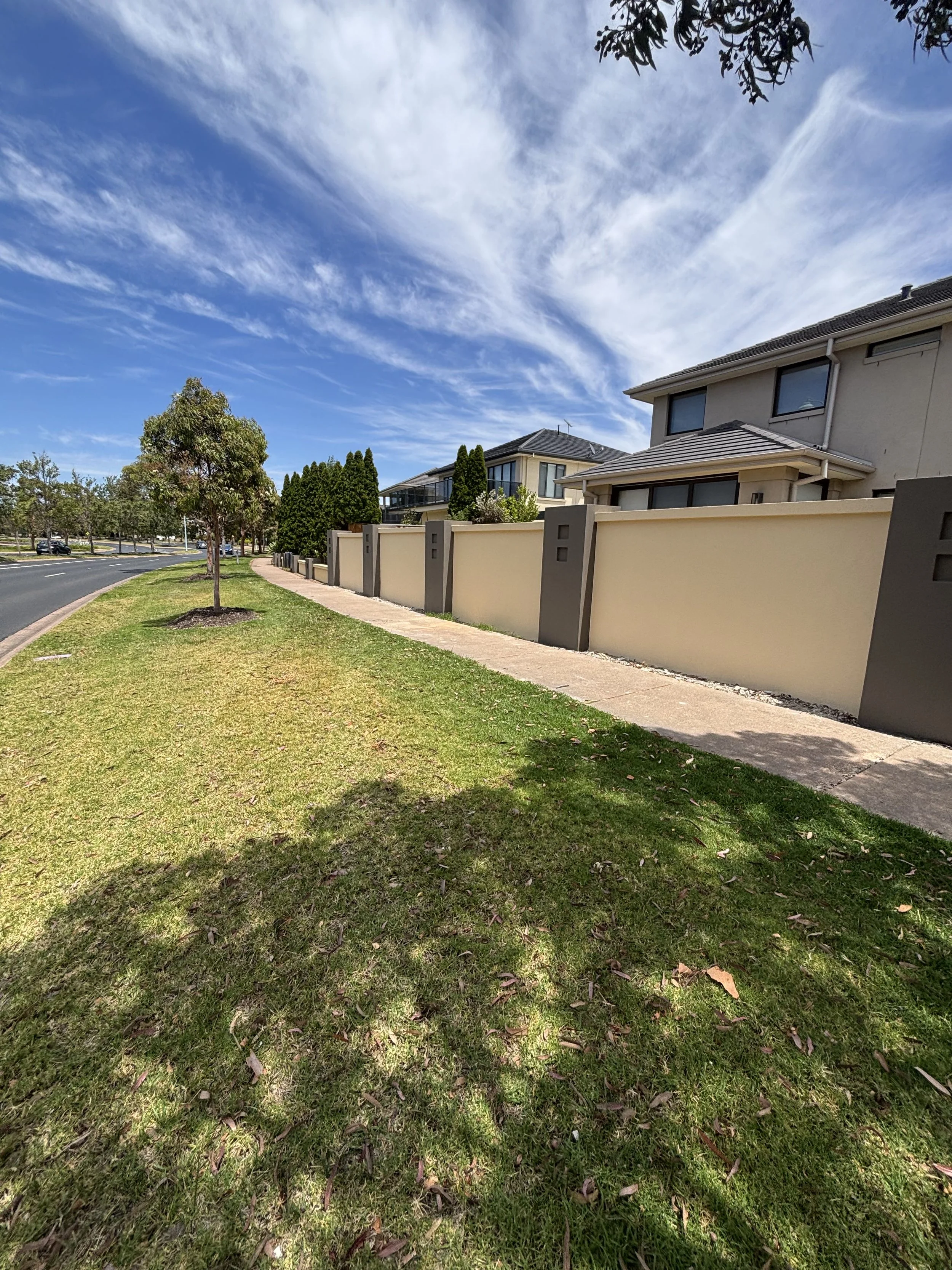 Render Fence Painting in Sanctuary Lakes: Refreshing a Street-Facing Feature
