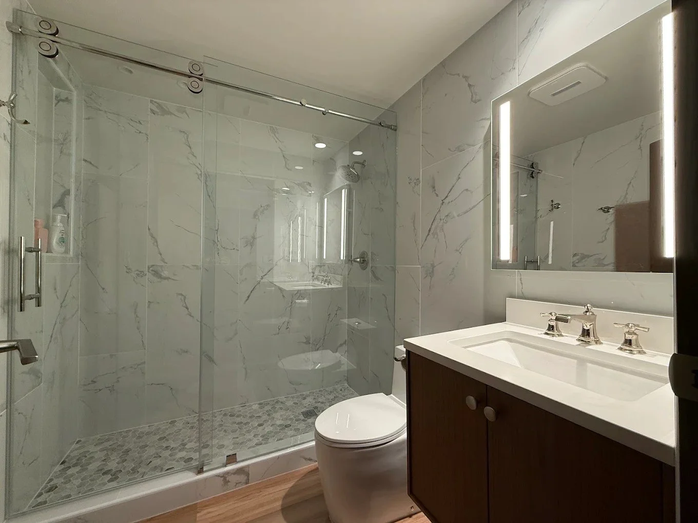 Custom frameless barn door shower glass sliders installation in Boerne, Texas