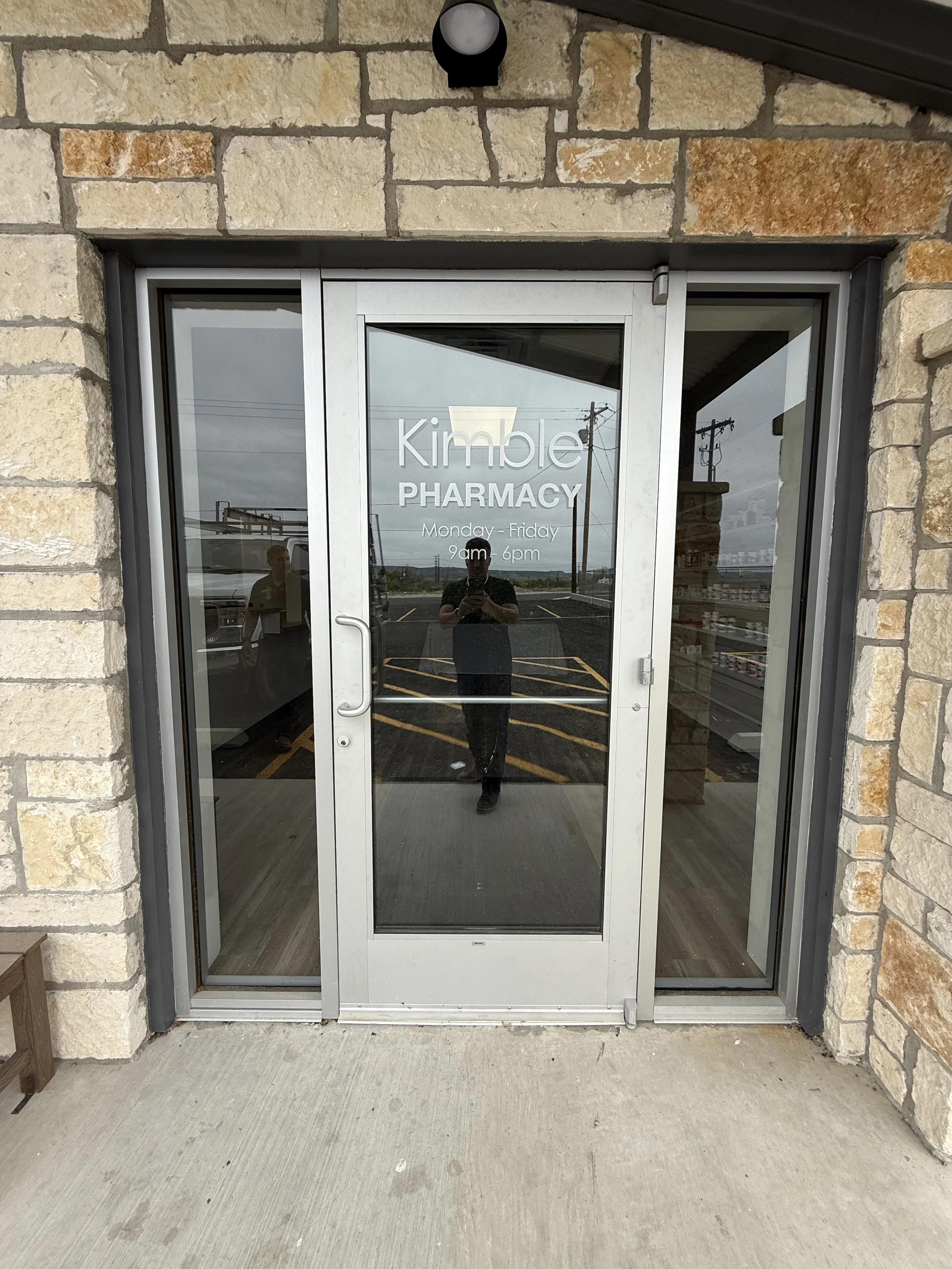 Commercial Storefront in clear anodized aluminum colored metal door glass replacement in Boerne, Texas