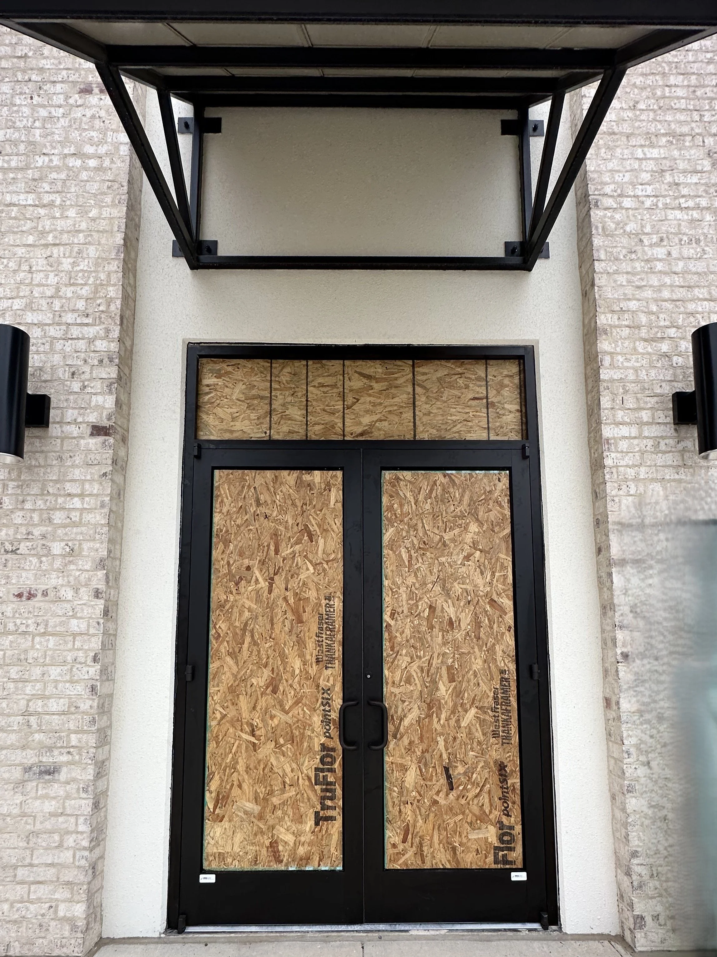 Commercial storefront doors before glass installation in San Antonio, Texas