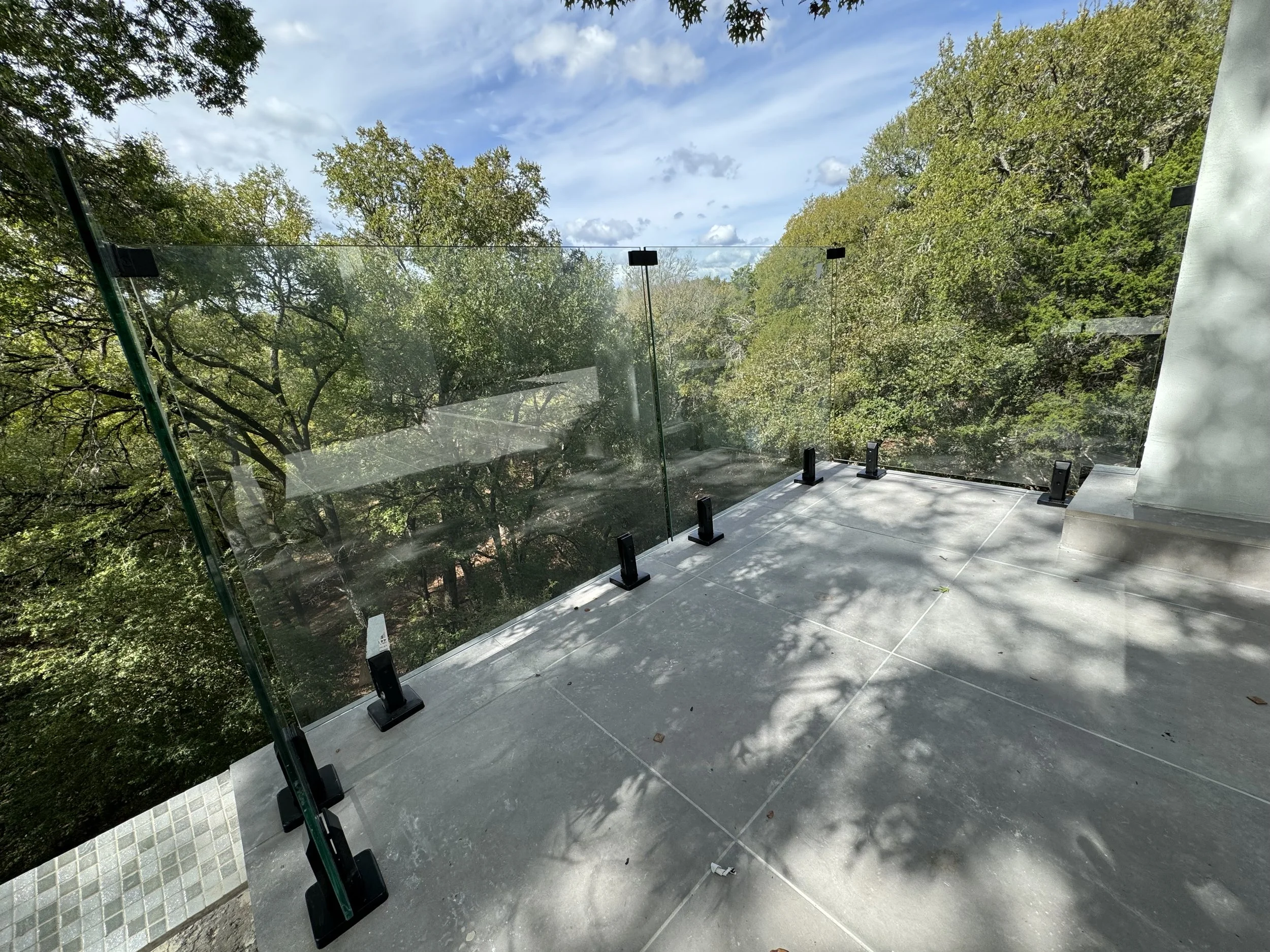 Pool side patio frameless glass handrail install by Proline Glass And Mirror in San Antonio, Texas.