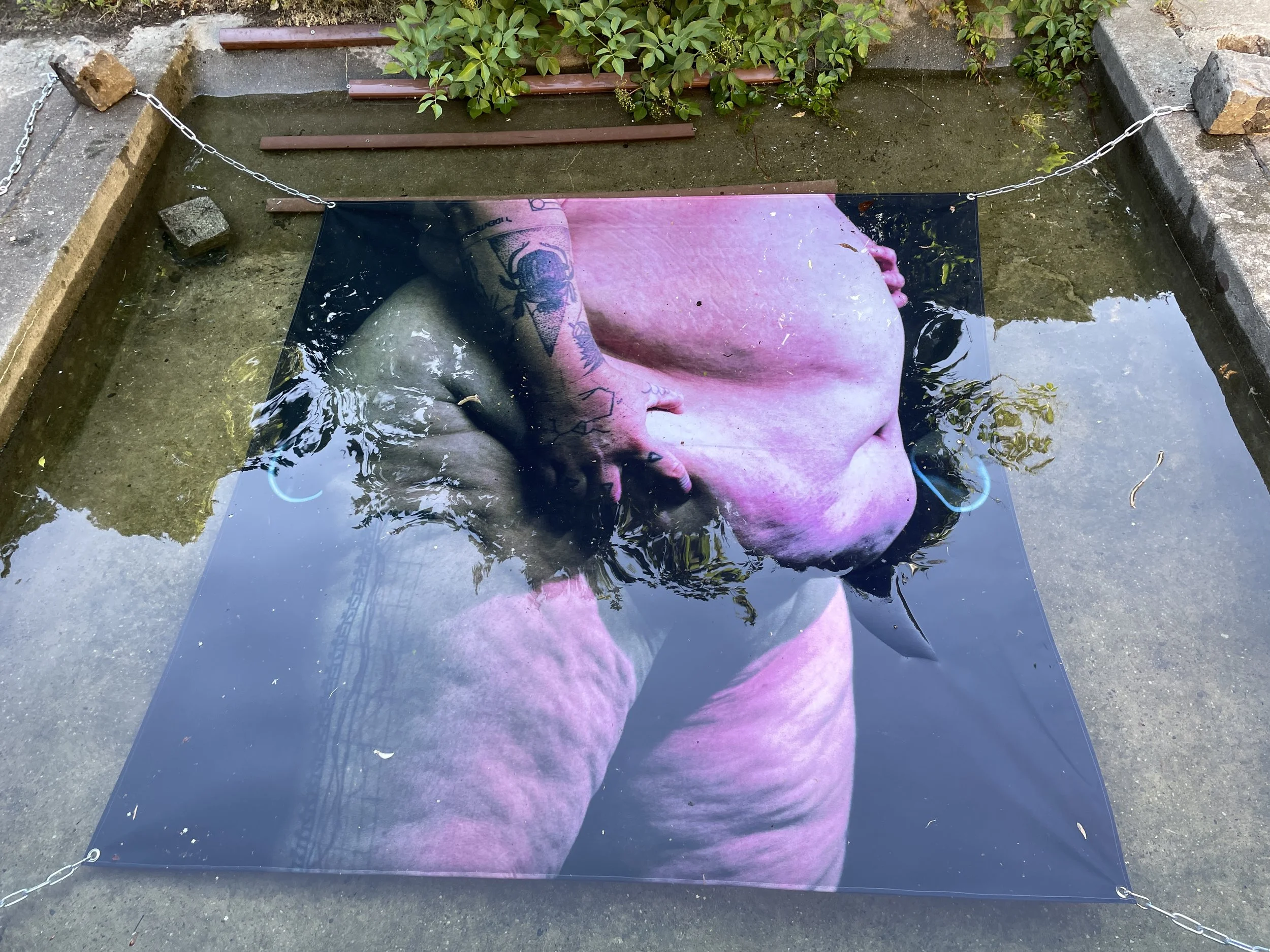 
Tremble, 2022 ( Bear Bath, Still #2), ink jet print on water resistant fabric. 

As part of my extended installation iteration of 'Tremble' at Bärenzwinger Art Gallery in Berlin, DE, I submerged films still printed on water resistant fabric in the o